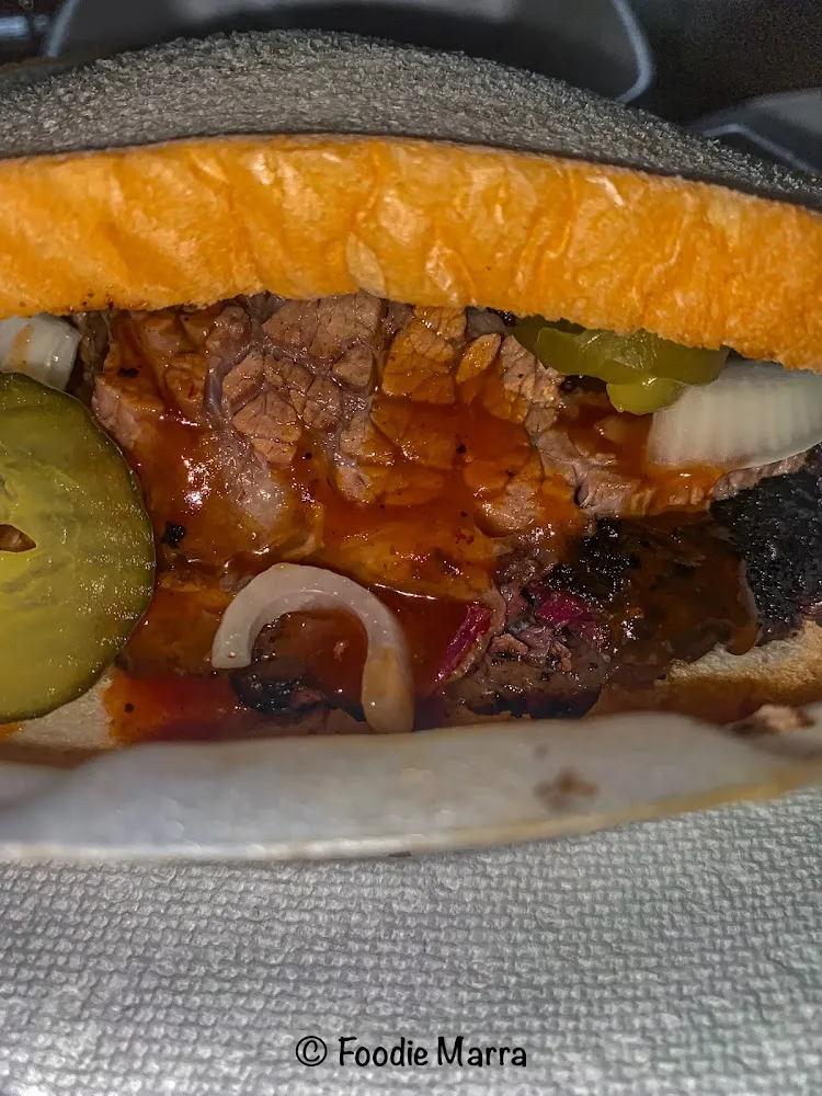 Sliced Brisket Sandwich with Pickles and Onions
